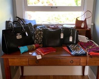 Designer handbags including Tory Burch, Valentino, Louis Vuitton, and more