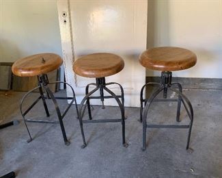 three adjustable bar or counter height stools