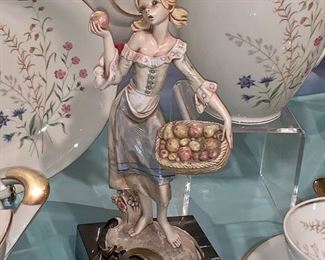 Marble stand and porcelain girl-Italy