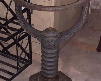 This is a vintage water heater holder- it looks great as a plant holder