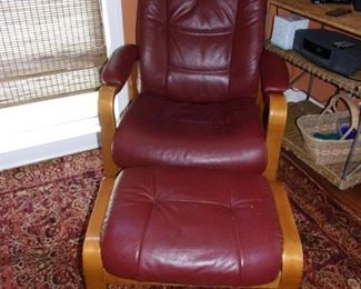 Pair of matching leather recliners with ottomans