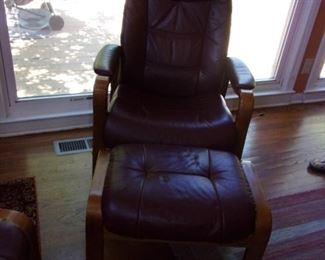 Pair of matching leather recliners with ottomans