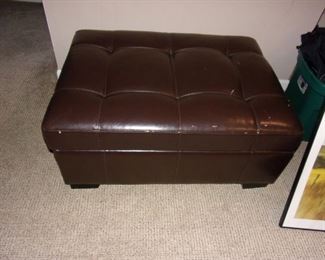 Pleather storage ottoman with some wear