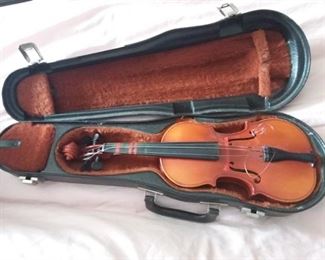 Suzuki  violin 1/8 with $25.00 this will be a great violin with value of about $300.00 with the following repairs..can be done at KC Strings in Merriam. $226 approx break down is  Sound post $45, Bridge $68, Strings $28, Tail piece $20 Bow $65 this could be a great family violin for several generations.
