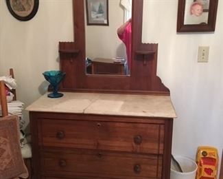 Antique dresser with mirror and marble top.