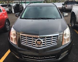 2010 Cadillac, 60,000 miles est. navy