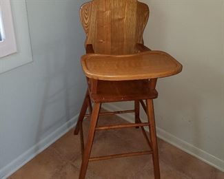 Vintage oak highchair.  NOT to current regulations, but great to display that old doll or teddy bear you have!!