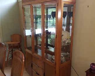 Lighted Stanley brand oak china cabinet'