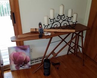 Old wood ironing board used as a table.  Great for a patio buffet, too!