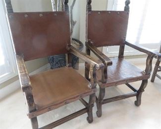 SPANISH COLONIAL LEATHER OAK SIDE CHAIRS
BROWN LEATHER LINED WITH LARGE BRASS TACKS EMBELLISHED WITH CARVED FINIALS
