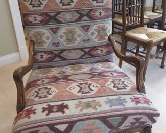 TRADITIONAL OPEN ARM CHAIR UPHOLSTERED IN NAVAJO RUG FABRIC  CURVED FEET ARE CONNECTED BY A CROSS STRECHER   
CHEYENNE CHESTNUT CLASSIC FINISH