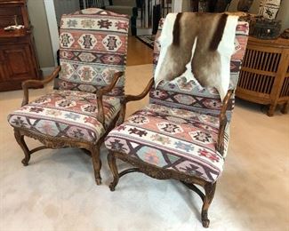 TRADITIONAL OPEN ARM CHAIRS UPHOLSTERED IN NAVAJO RUG FABRIC  CURVED FEET ARE CONNECTED BY A CROSS STRECHER   
CHEYENNE CHESTNUT CLASSIC FINISH

