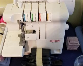#26	Singer 14 Ultralock U444B/454B 4 spool Serger	 $100.00 
