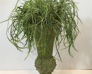 Footed vase with artificial plant