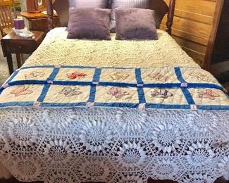 A closer look at the vintage crocheted bed cover, as well as the vintage handmade butterfly quilt