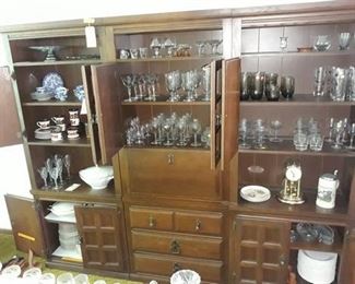 Three Piece Cabinet with a Generous Collection of Glassware and Dishes