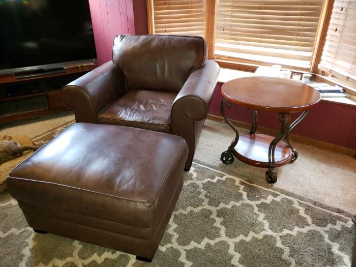 Pottery Barn, brown leather chair and matching ottoman, excellent condition. Wood and metal round table