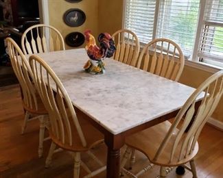 Large marble top kitchen table kitchen table.  6 chairs, fair condition.