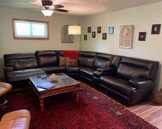 Sectional couch black mahogany leather with electrical plug-ins and electrical chairs in mint condition less than a year old
