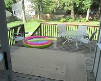 Patio set, chaise, kids pool and rolling hammock, electric smoker not shown