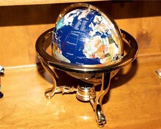 5. A Mineral Globe with Brass Stand.