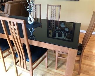 Glass top wood dining table with 6 chairs reminiscent of Frank Lloyd Wright style chairs 72" L 43"W