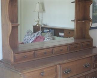 long chest with upper shelves and mirror.
