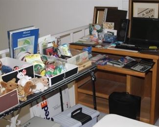 Beanie Babies, office supplies, laptop, speakers, computer desk.