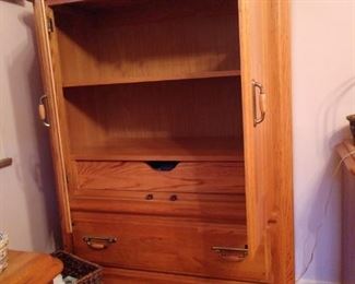 Armoire with drawers and shelves inside