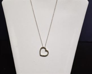 18k white gold heart necklace.   https://ctbids.com/#!/description/share/171861