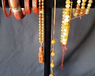 Coral colored bracelets and necklaces https://ctbids.com/#!/description/share/171886