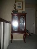 Small glass front china cabinet
