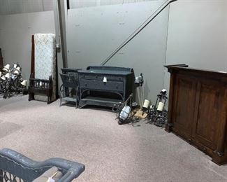 #132		Wicker Buffett with 3 drawers and shelf (heavy) 49x21x37-42	 $200.00 
#133		6 light candle look chandelier as is (heavy)	 $75.00 
#134		Chandelier with 5 outside lights and 1 center globe	 $45.00 
#135		Antique wicker magazine rack 39x17x25	 $100.00 
#136		Antique childs bed/bench w rails 25x71	 $75.00 
#137		Chandelier with 12 lights, shades, and prisms	 $75.00 
