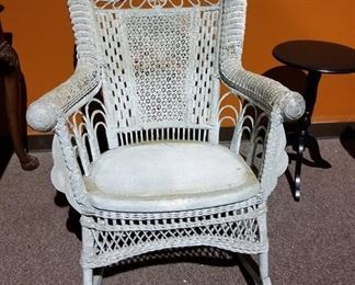 #118 Wicker rocking chair w/high back $75.00 