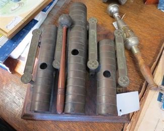 Antique chimes by J. C. Deagan and holy water sprinkler from a Catholic Church.