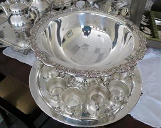 Silverplate punch bowl with underplate and cups.
