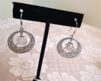 Sterling (950) pierced earrings.