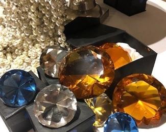 Oversized, glass gems in lined presentation boxes.