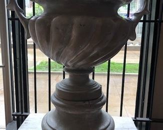 Oversized urns and planters for inside or outside use.