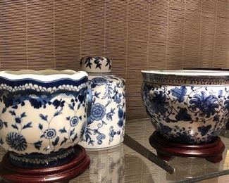 Blue and white cachepots, ginger jars and fish bowls in a variety of styles, shapes and large quantities.