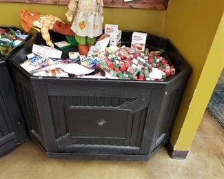 Plastic display bin with contents on top