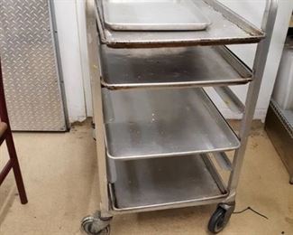 Half-size Sheetpan Rack on Casters with 4 full size sheet pans and 1 Half size sheet pan