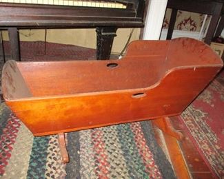 cradle & braided rug