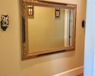  There are a few oversized beveled mirrors 