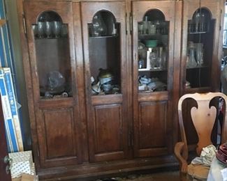This piece is now in garage, perfect condition, two pieces that fit into bottom. COME AND GET THIS HUGE CHINA CABINET.