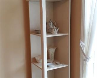 white wooden corner shelf