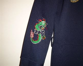 details of embroidery on his "Korean drinking suit"