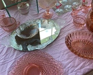 Over 125 pieces of pink depression glass.