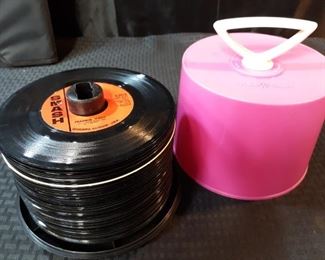 Stack of 45s records in travel case