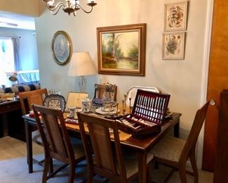 Large dining table with 2 leaves and six chairs.